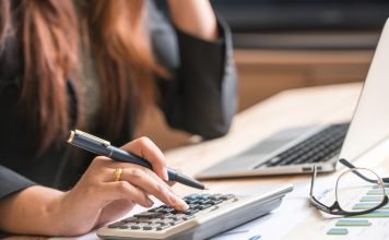 Essential Security Features for a Reliable Document Management System Close up of female accountant or banker making calculations. Sav
